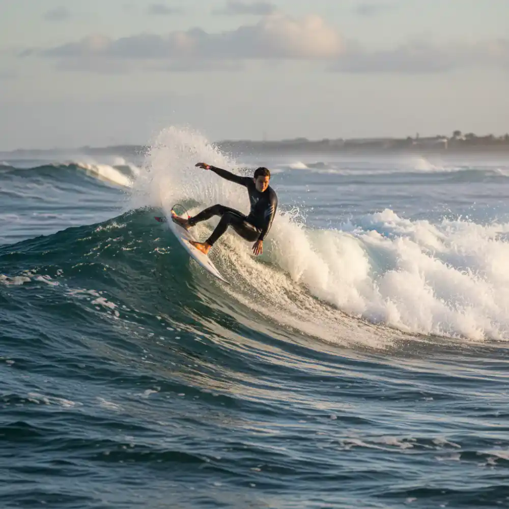 Surfer performing a carving turn